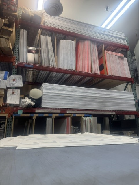 Warehouse racking stacked with blank and finished traffic sign panels